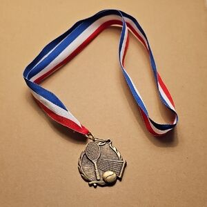 Gold Tennis Medal with Red, White, and Blue Ribbon